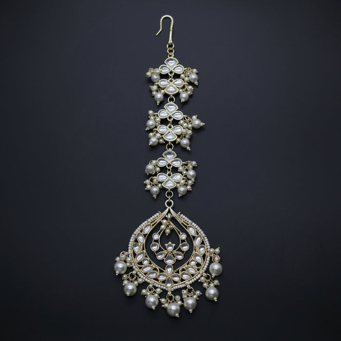 Ornate necklace with pearls on a dark background
