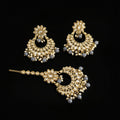 Ornate gold and gemstone jewelry set on a dark background with 'Saheli' branding.