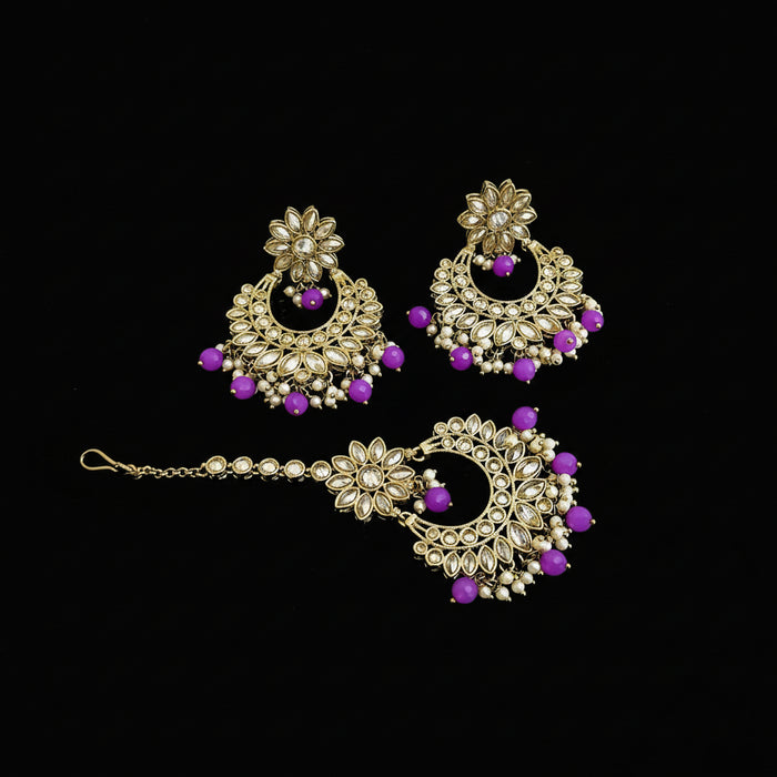 Gold and purple jewelry set with 'Saheli' branding on a dark background