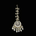 Decorative pearl necklace with gold accents on a dark background