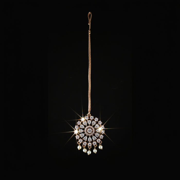 Jewelry pendant with intricate design on a dark background