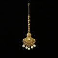 Gold necklace with pearl pendants on a gray background, featuring the brand 'Saheli'.