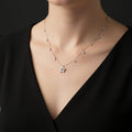 Necklace with a floral pendant on a black background