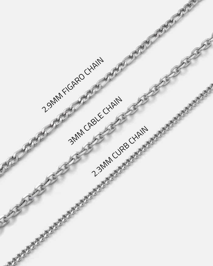 Three silver chains—2.9mm Figaro chain (top), 3mm Cable chain (middle), and 2.3mm Curb chain (bottom)—each highlight their unique link styles against a white background, making them perfect for layering with your favorite Statement Collective Cross & Dagger Necklace or adding an edge with a skull heart pendant for a touch of dark romance.