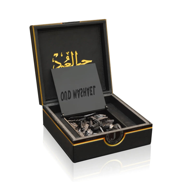 Luxury Jamr Al Oud perfume gift box with oud wood chips and elegant branding