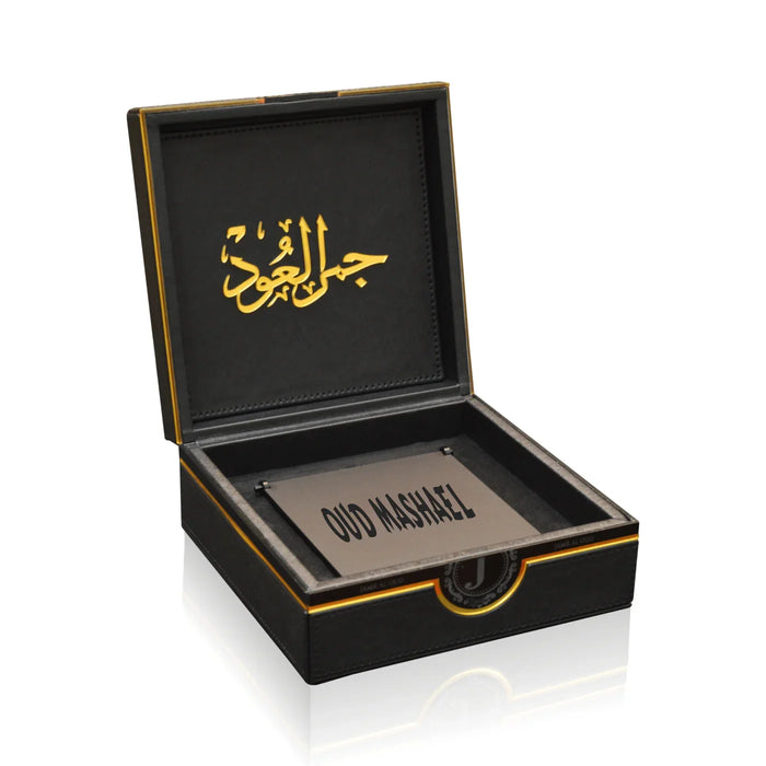Luxury black Oud Mashael gift box by Jamr Al Oud Perfumes with gold Arabic script.
