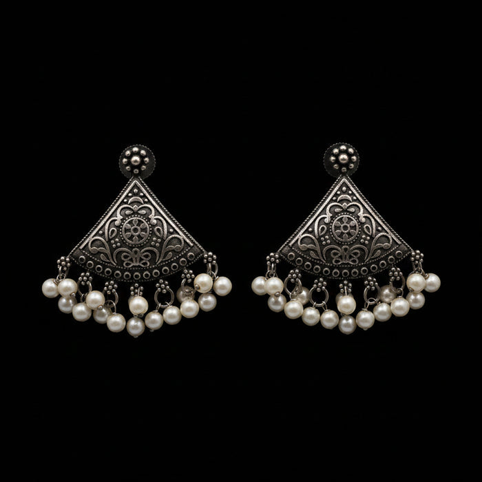 A pair of traditional Indian silver-toned filigree dangle earrings with white pearl bead drops, displayed on a light gray background with the brand logo 'SAHELL MY BEST FRIEND' above them.