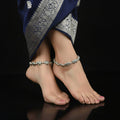 Silver elephant-themed anklet on a dark background with 'SAHELI' branding.