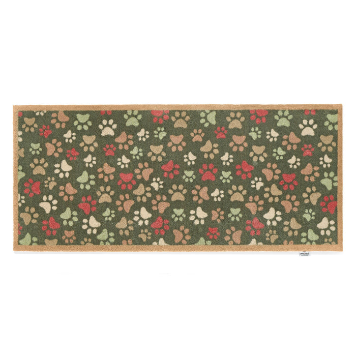 Paws for Love Washable Runner in Green- a 100% recycled cotton runner featuring multi-coloured paw prints in a multi-directional pattern.