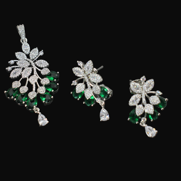 Jewelry set with pendant and earrings on a dark background