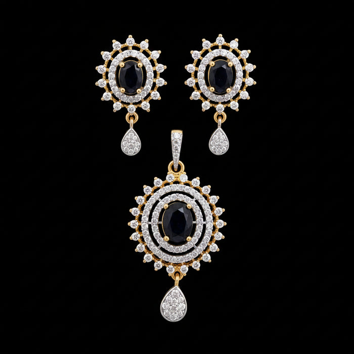 Ornate earrings with black gemstones and gold accents on a gray surface, branded 'SAHELI'.