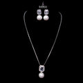 Jewelry set with necklace and earrings on a black background, featuring the brand 'Saheli'.