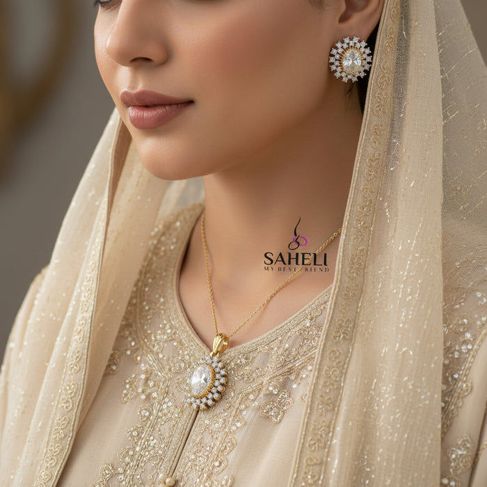 Gold and diamond earrings on a dark background with 'SAHELI' branding.