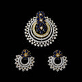 Ornate earrings with blue and gold accents on a dark background, featuring the brand 'Saheli'.