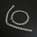 Silver necklace with a clasp on a dark background