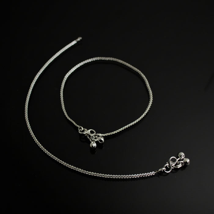 Silver necklace with pendant on a dark background