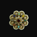 Decorative ring with multicolored gemstones on a dark background