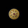 An ornate circular gold-toned brooch or decorative pin featuring a central red gemstone surrounded by clear stones in a floral mandala pattern, displayed on a dark gray background with a 'SAHELL MY BEST FRIEND' watermark in the top right.