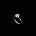 Silver ring with a large diamond on a black hand, brand 'Saheli' visible.