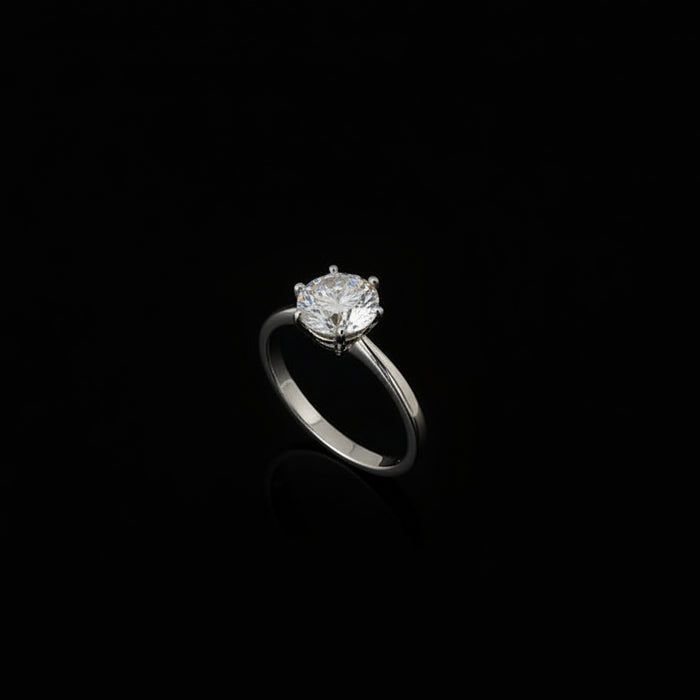 Silver ring with a large diamond on a black hand, brand 'Saheli' visible.