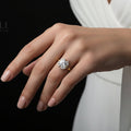 Diamond ring on a dark stone surface with 'Saheli' branding.