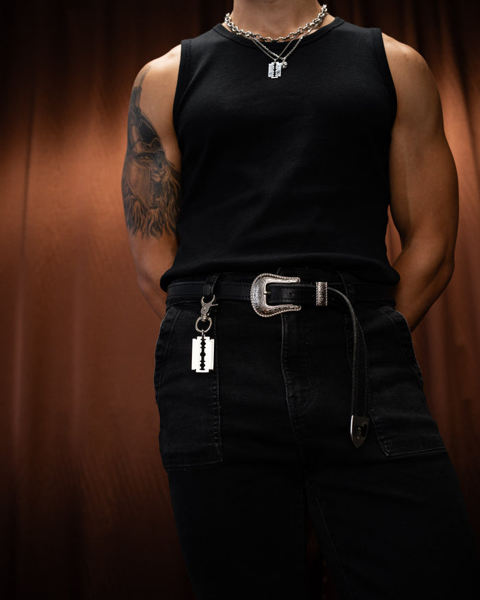 Model wearing Statement Collective Razorblade Belt Clip
