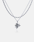 The Statement Collective Rope Set features a silver double-chain necklace with a custom pendant choice, shown here as a detailed angel holding a star. Stainless steel, hypoallergenic, and set against a white background for contrast.