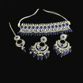 Silver and blue jewelry set on a dark background