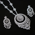 Diamond necklace and earrings set on a black background