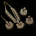 Jewelry set with necklaces and earrings on a dark background