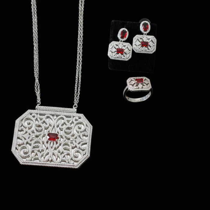 Jewelry set with necklace and earrings on a gray background