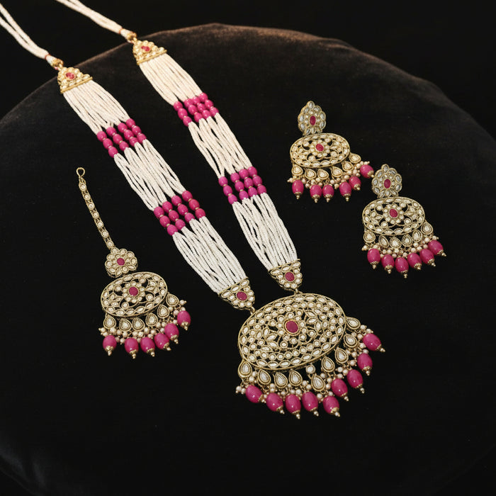 Jewelry set with necklace, earrings, and hair accessories on a dark background