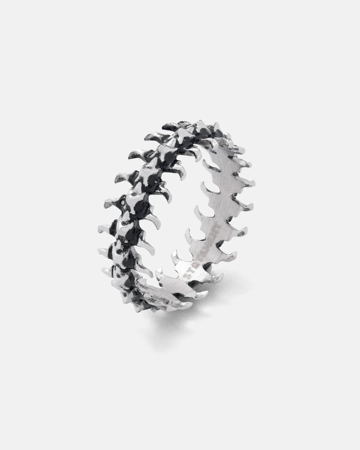 band ring with fishbone design on white background