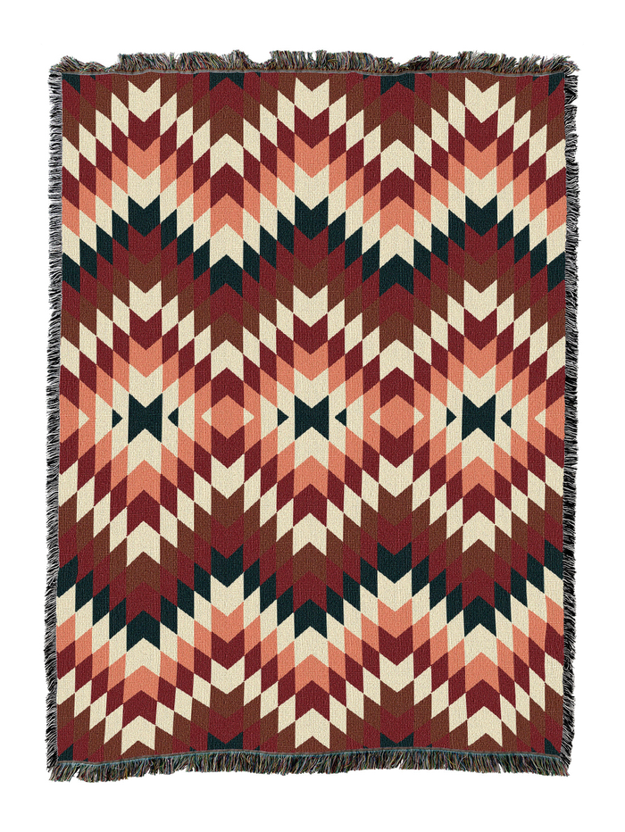Sandy cotton throw in the Deep Teal colorway, a soft flame stitch zigzag of dusty rose and brick through cream over a dark teal base