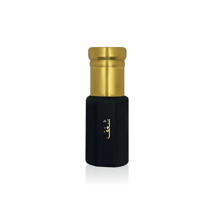 Luxury Jamr Al Oud black perfume bottle with gold cap and Arabic script on white background