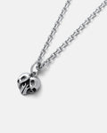 The Skull Heart Pendant is a silver-tone stainless steel necklace with a detailed skull heart charm, displayed on a light gray background—ideal for fans of dark romance jewelry.