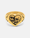 Introducing the Skull Heart Ring (Gold) by Statement Collective—a bold heart-shaped ring featuring two black-etched skulls facing each other at its center and intricate decorative markings along the band. Finished with an 18k gold plated sheen, this striking piece of gothic jewellery is sure to make a statement.