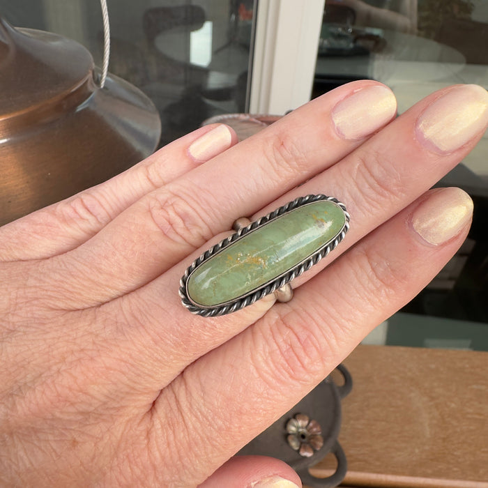 Wildflower Artisans long oval Sonoran Mountain turquoise ring in sterling silver with twisted rope bezel detail.