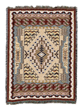 Southwest Butte cotton throw in the Clay colorway, a stepped diamond medallion on a cream field framed by layered zigzag borders in rust, navy and blue grey