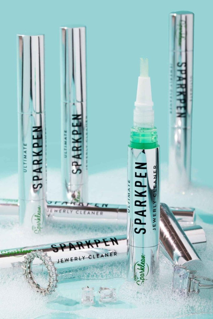 Sparklean Sparkpen cleaning pen in use on a ring setting