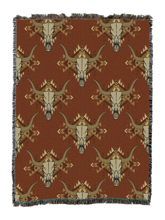 Steer skull cotton throw in the Orange colorway, repeating longhorn skulls in tan and cream on a warm rust brown ground