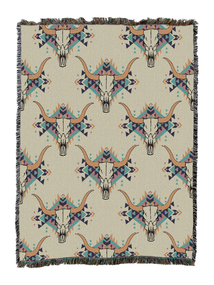 Steer skull cotton throw in the White colorway, repeating longhorn skulls in tan with blue and teal accents on an ivory ground