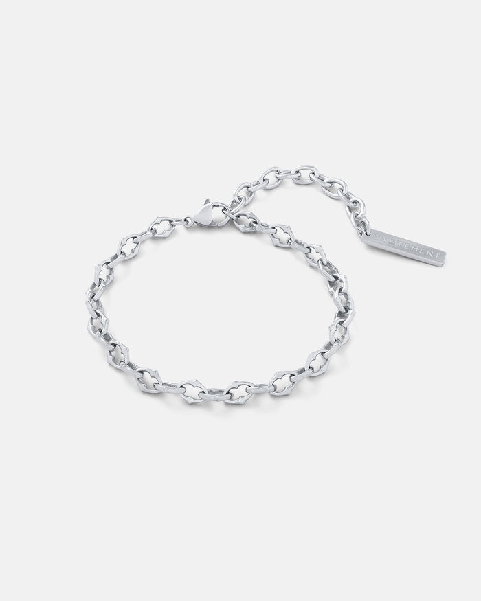 Silver 6mm Spiked chain link bracelet by statement collective on grey background