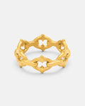 Introducing “The Cathedral” Spiked Ring in Gold by Statement Collective—a striking 18k gold ring with an openwork, geometric pattern of linked pointed arches that evoke a crown-like silhouette. Finished with a matte sheen, the ring is beautifully presented against a light gray background.