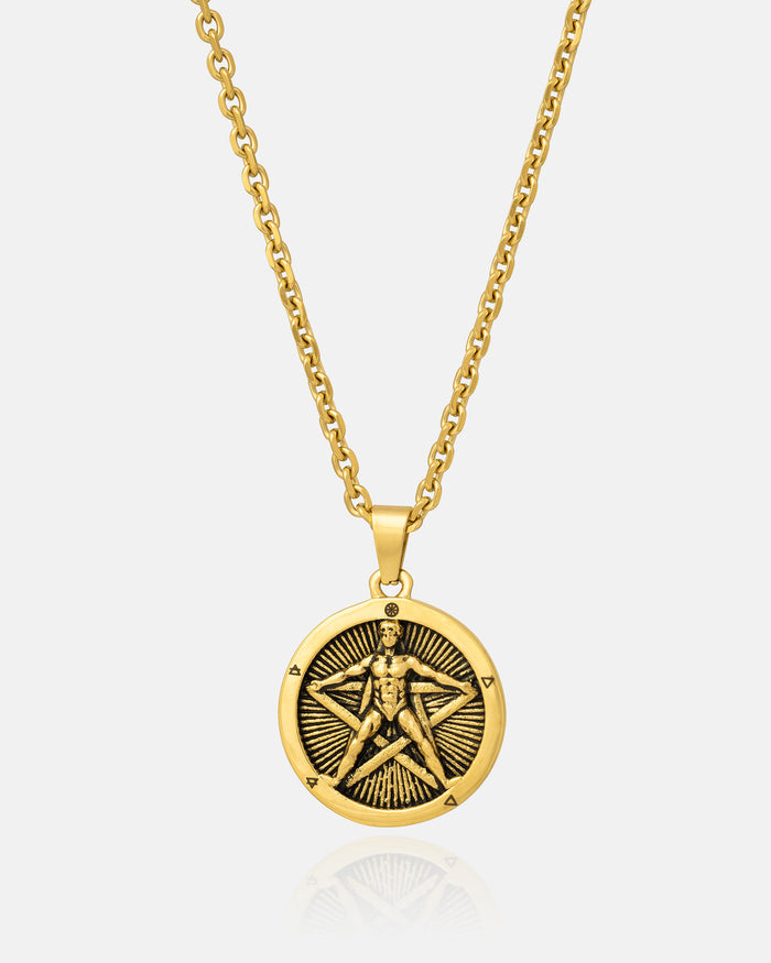 The Star of the Magi" Pendant (Gold) is an 18K gold-plated necklace with a round pentagram pendant, embossed with a human figure inside a five-pointed star and surrounded by radiating lines.