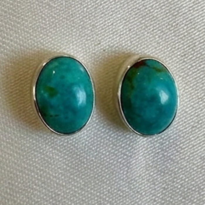 Wildflower Artisans oval turquoise stud earrings, approx. 10mm, set in sterling silver with natural matrix.