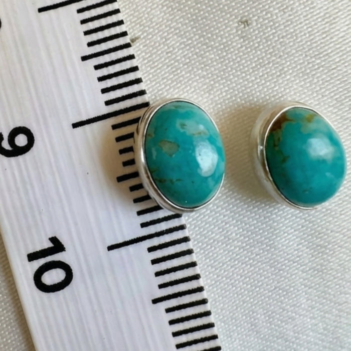 Wildflower Artisans oval turquoise stud earrings, approx. 10mm, set in sterling silver with natural matrix.