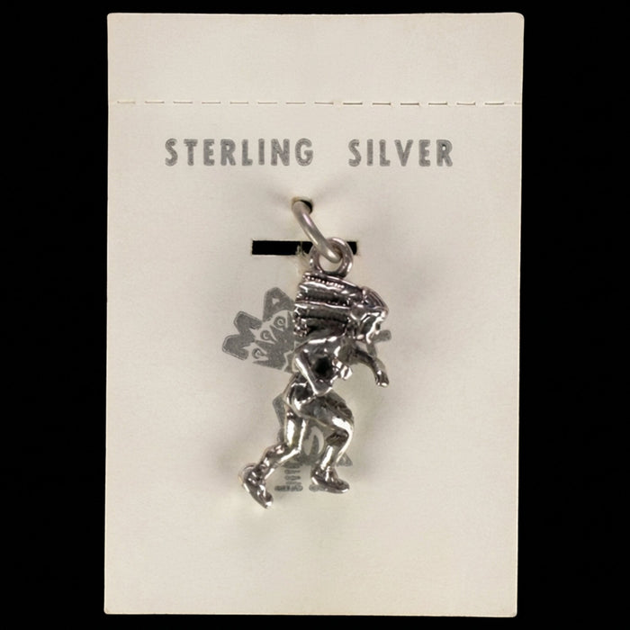 Wildflower Artisans vintage sterling silver dancer charm with headdress on original Maisel's trading post display card.