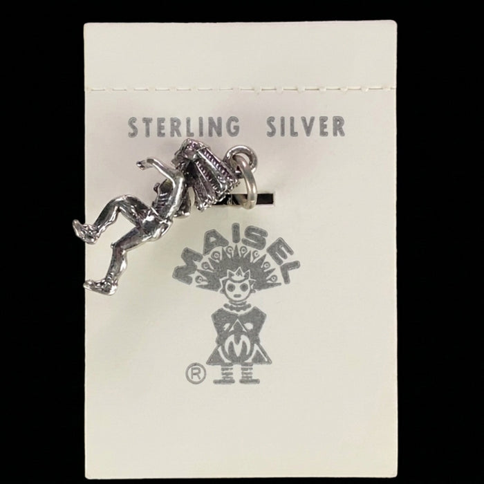 Wildflower Artisans vintage sterling silver dancer charm in a headdress on original Maisel's display card.