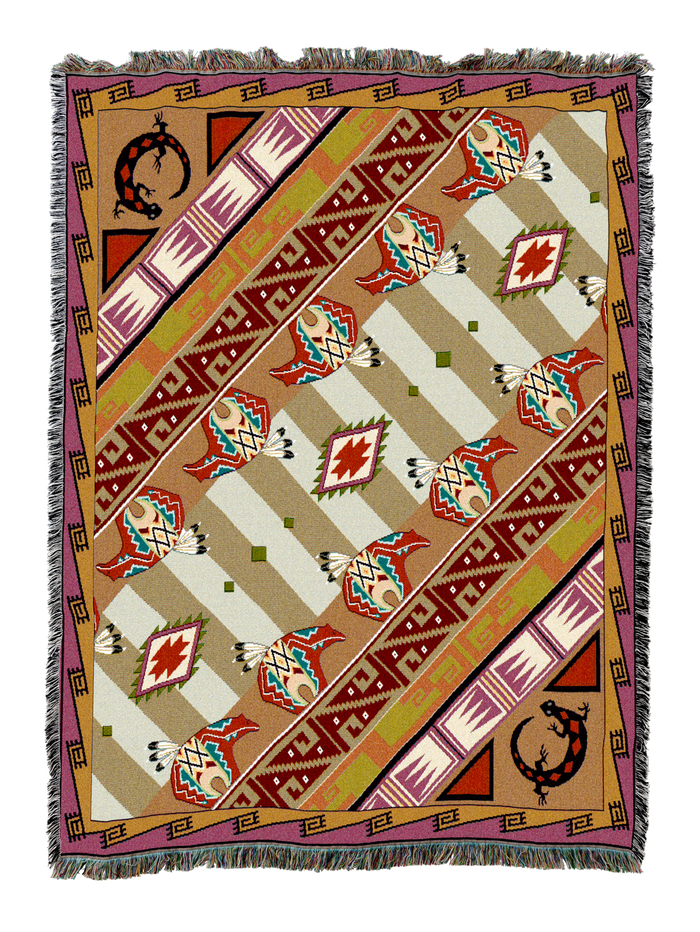 Western Slant cotton throw in the Copper colorway, the same diagonal aztec banding worked in copper, tan and red with horseshoe motifs in the corners